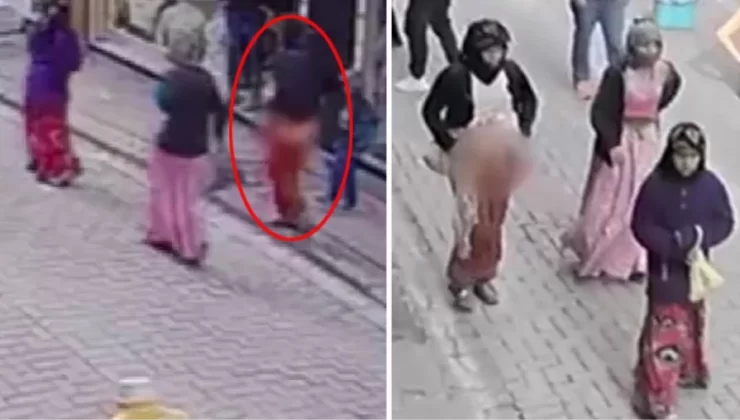 Mağazadan çanta çalıp sokak ortasına soyunan kadın hırsız kamerada! Esnaf yaklaşamadı